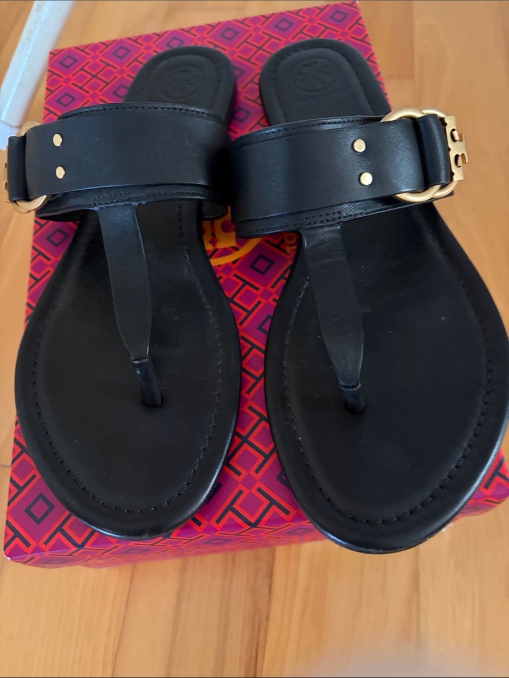 Tory Burch Black Leather Toe-Post Sandals with Gold Buckle Accent